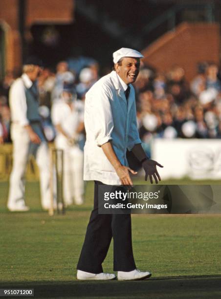 Umpire Harold Dickie Bird shares a joke during a match at the County Ground in Taunton, England circa 1984.