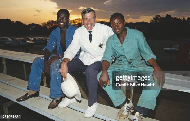 Cricket Umpire Harold 'Dickie' Bird pictured with groundsmen at the Harare Sports Club during the First Test Match between Zimbabwe and India on...