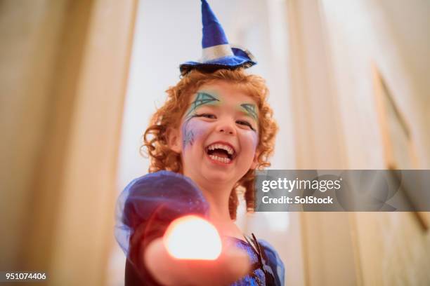 scary witch and her magic wand - witch wand stock pictures, royalty-free photos & images