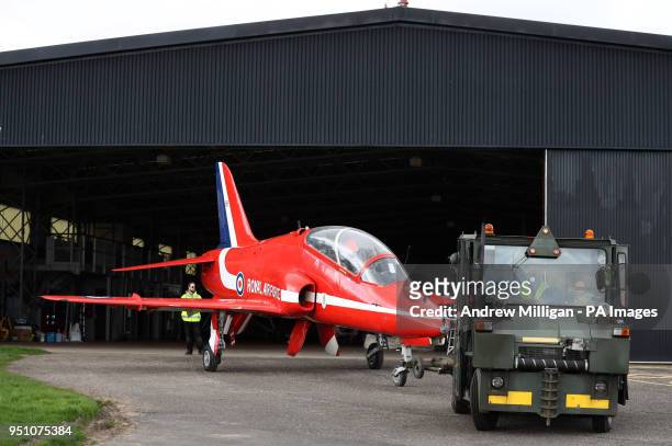The Red Arrows Hawk is maneuvered into a hanger next to Concorde where it will be on display at the National Museum of Flight, East Fortune, which...