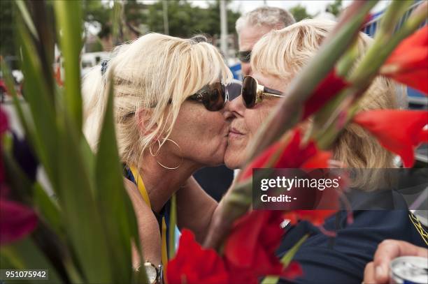 Year-old Ilona embraces another woman after being the first woman to arrive at the finishing line in the 95th edition of the international four day...