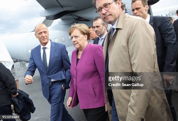 Airbus CEO Tom Enders, German Cahncellor Angela Merkel and Transport and Digital Infrastructure Minister Andreas Scheuer walk through the Airbus...