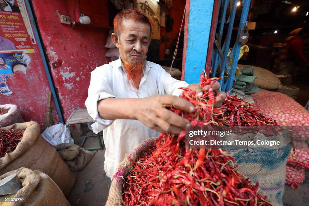 Market vendor with chilies in Dhaka, Bangladesh