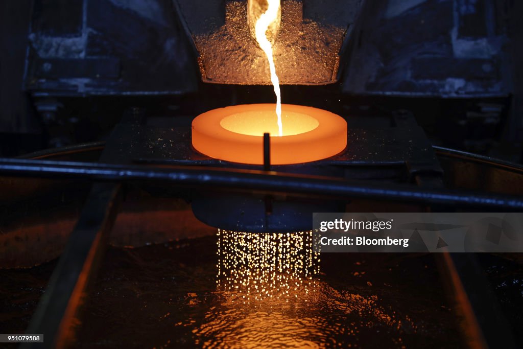 Compression Casting Gold Molten gold flows into water to produce the gold casting grain at the ...