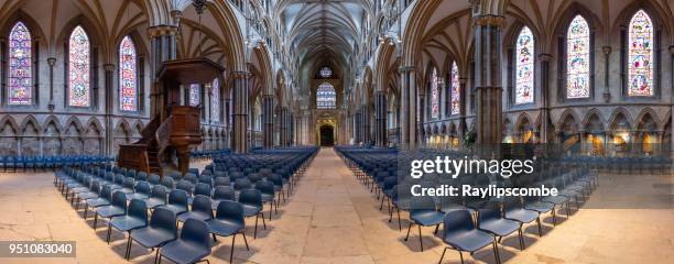 interior panorama of lincoln cathedral showing the beautiful stain glass windows and rows of seating for the congregation. - gothic style imagens e fotografias de stock