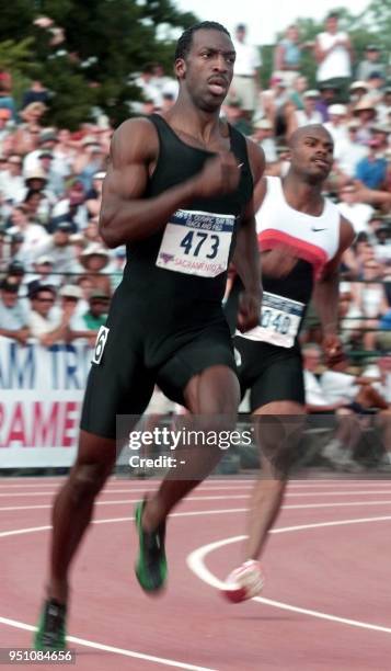 Michael Johnson leads Alvin Harrison in the men's 400-meter semi-final heat 15 July 2000 during the 2000 US Olympic Team Trials at Hornet Stadium,...
