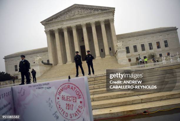 Activists rally against the Muslim Ban on the day the Supreme Court hears arguments in Hawaii v. Trump in front of the court in Washington, DC on...