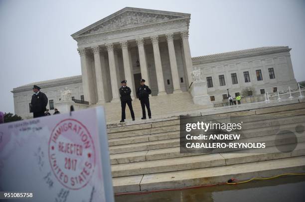 Activists rally against the Muslim Ban on the day the Supreme Court hears arguments in Hawaii v. Trump in front of the court in Washington, DC on...