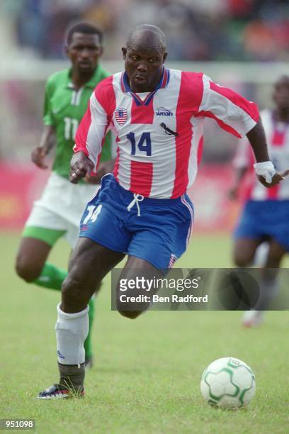 George Weah of Liberia runs with the ball during the World Cup 2002 Group B Second Round Qualifying match against Nigeria played at Port Harcourt, in...