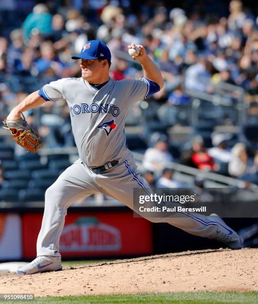 Pitcher Aaron Loup of the Toronto Blue Jays pitches in an MLB baseball game against the New York Yankees on April 21, 2018 at Yankee Stadium in the...