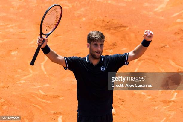 Martin Klizan of Slovakia celebrates his victory against Novak Djokovic of Serbia after their match during day three of the Barcelona Open Banc...