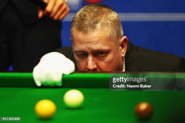Referee Paul Collier lines up the balls during day five of the World Snooker Championship at Crucible Theatre on April 25, 2018 in Sheffield, England.