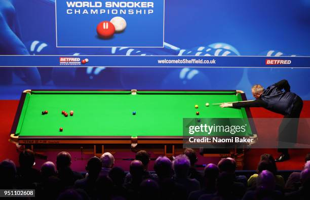 John Higgins of Scotland in action during his first round match against Thepchaiya Un-Nooh of Thailand during day five of the World Snooker...