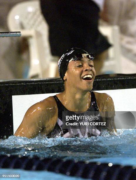 The Panamanean Eileen Coparropa celebrates, 29 November 2002, after winning the gold medal in the 50 meter freestyle swimming competition of the...