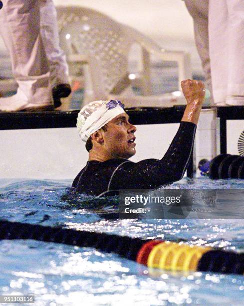 The Mexican Juan Jose Veloz Davila celebrates his victory, 25 November 2002, in the 400 meter race of the XIX Central American and Caribbean Games El...