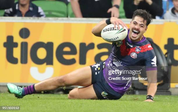 Young Tonumaipea of the Melbourne Storm scores a try during the round eight NRL match between the Melbourne Storm and New Zealand Warriors at AAMI...