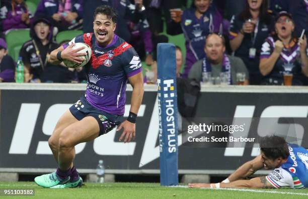 Young Tonumaipea of the Melbourne Storm scores a try during the round eight NRL match between the Melbourne Storm and New Zealand Warriors at AAMI...