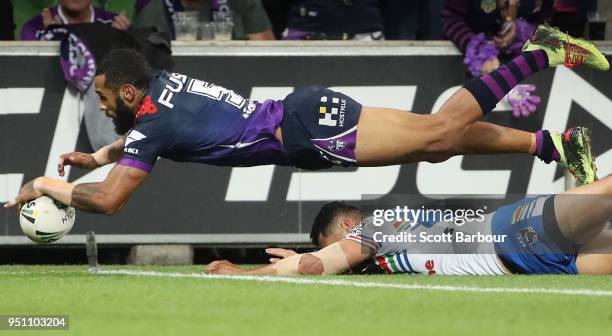 Josh Addo-Carr of the Melbourne Storm scores a try during the round eight NRL match between the Melbourne Storm and New Zealand Warriors at AAMI Park...