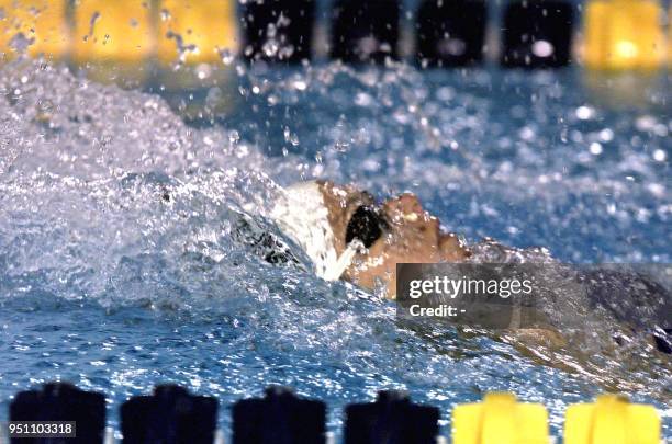The Mexican swimmer Maristany Amescua competes 26 November 2002 in San Salvador, in the 100 meter race during the Central American and Caribbean...