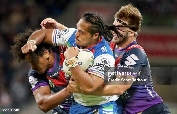 Agnatius Paasi of the Warriors is tackled during the round eight NRL match between the Melbourne Storm and New Zealand Warriors at AAMI Park on April...