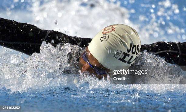 Mexican Joshua Ilika swims, 25 November 2002, during the butterfly stroke competition of 100 meter race of the XIX Central American and Caribbean...