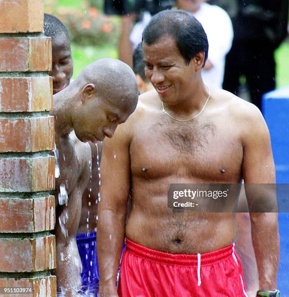 Saul Martinez of Honduras relaxes at a thermal pool along with teammates and coaches, 24 July 2001 in Manizales, Colombia. The Hondurans scored one...
