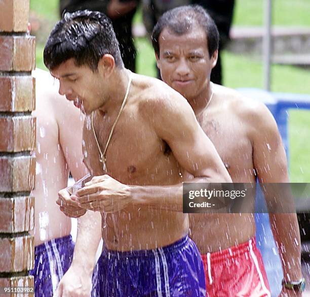 Players and coaches of the Honduras soccer team relax at a thermal pool 24 July 2001 in Manizales, Colombia. The Hondurans scored one of the greatest...