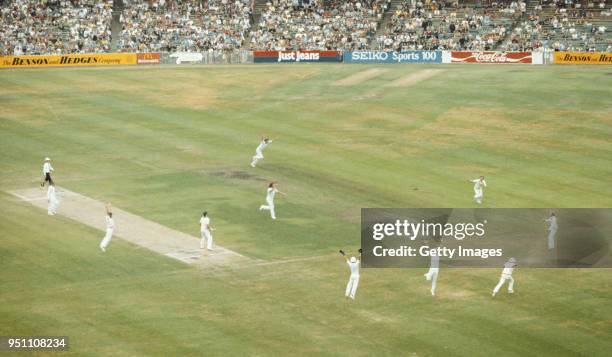 England slip fielder Geoff Miller runs off in celebration after catching out Australia batsman Jeff Thomson via a deflection from second slip Chris...