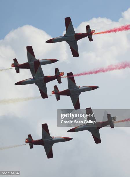 Planes of the Spanish stunt group Patrulla Aguila fly at the ILA Berlin Air Show on April 25, 2018 in Schoenefeld, Germany. ILA Berlin is Europe's...