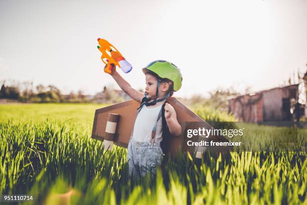 tough little boy - arma de brinquedo imagens e fotografias de stock