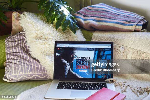 The Time Warner Inc. CNN brand television series "Anthony Bourdain: Parts Unknown" is displayed on an Apple Inc. Laptop computer in this arranged...