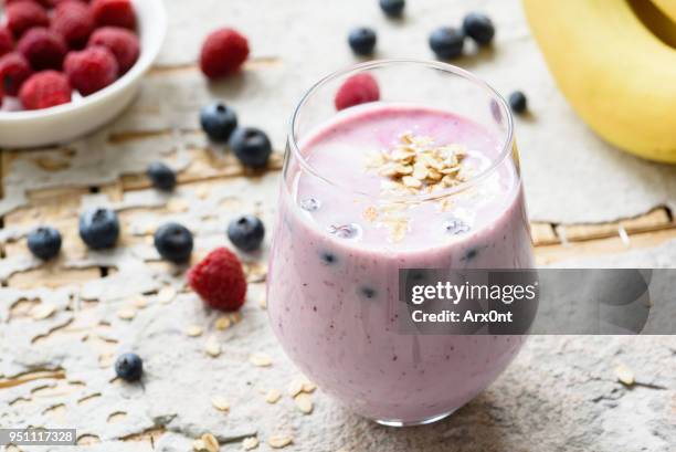 healthy berry smoothie with oats - milkshake stock pictures, royalty-free photos & images