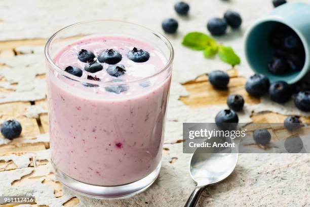 blueberry smoothie in glass - berry smoothie stock pictures, royalty-free photos & images