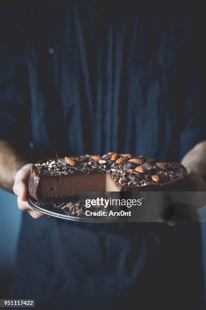 hands holding chocolate pie - chocolate pie stock pictures, royalty-free photos & images