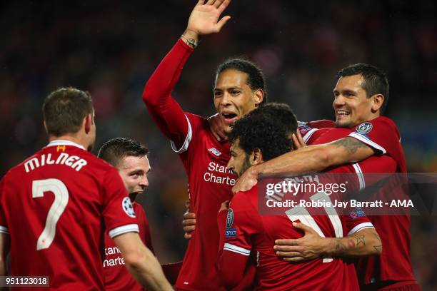 Roberto Firmino of Liverpool celebrates after scoring a goal to make it 4-0 during the UEFA Champions League Semi Final First Leg match between...