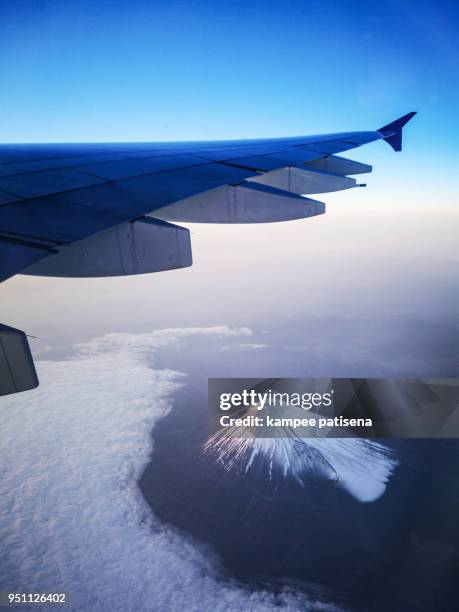 mt. fuji aerial photo from airplane - tokai region stock-fotos und bilder