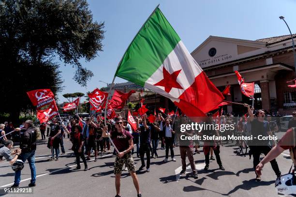 Italian partisans wave flags during a rally to celebrate the 73rd Liberation Day on April 25, 2018 in Rome, Italy. Italy's Liberation Day is a...