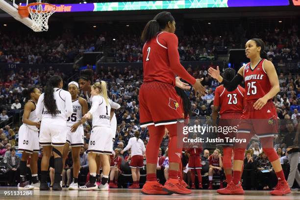 Asia Durr and Myisha Hines-Allen of the Louisville Cardinals celebrate during the semifinal game of the 2018 NCAA Photos via Getty Images Division I...