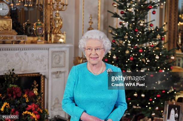 Queen Elizabeth II prior to the recording of her Christmas Day broadcast to the Commonwealth, in the White Drawing Room at Buckingham Palace on...