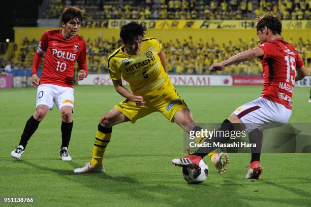 Yuta Nakayama of Kashiwa Reysol and Kazuki Nagasawa of Urawa Red Diamonds compete for the ball during the J.League J1 match between Kashiwa Reysol...