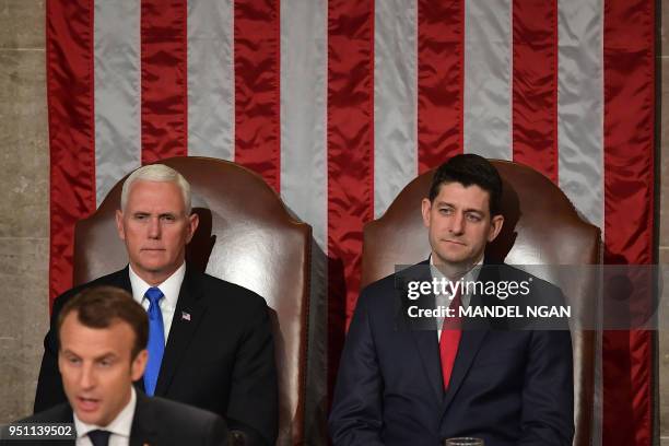 House Speaker Paul Ryan( and US Vice President Mike Pence listen as France's President Emmanuel Macron addresses a joint meeting of Congress inside...