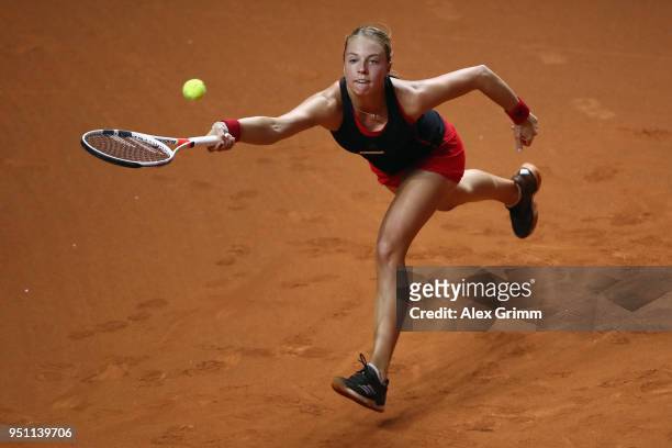 Anett Kontaveit of Estonia plays a forehand to Kristina Mladenovic of France during day 3 of the Porsche Tennis Grand Prix at Porsche-Arena on April...