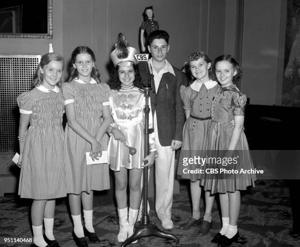 Radio childrens program March of Games, broadcast from the Hotel New Yorker. Co-hosts majorette Sybil Trent and Arthur Ross , is the young master of...