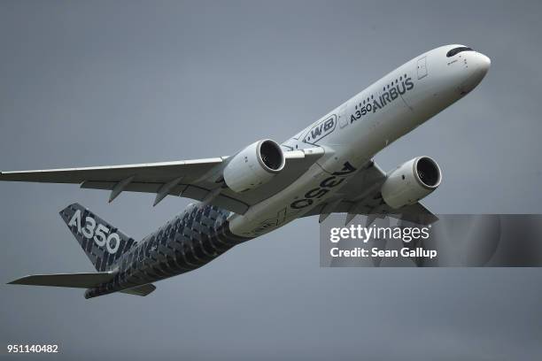 An Airbus A350-900 passenger plane flies at the ILA Berlin Air Show on April 25, 2018 in Schoenefeld, Germany. ILA Berlin is Europe's third largest...