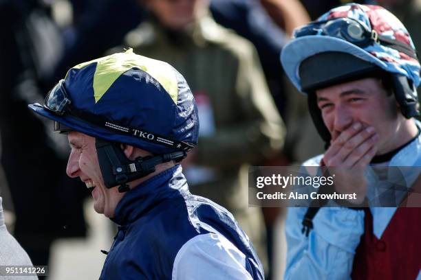 Jockey Paul Townend makes his way to the parade ring a day after being banned for 21 days for dangerous riding as he shares a joke with David Mullins...