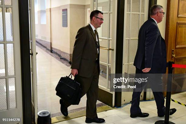 Sgt. Richard Schaffer of the Cheltenham Township Police Department, left, arrives outside courtroom A for the Bill Cosby sexual assault trial at the...