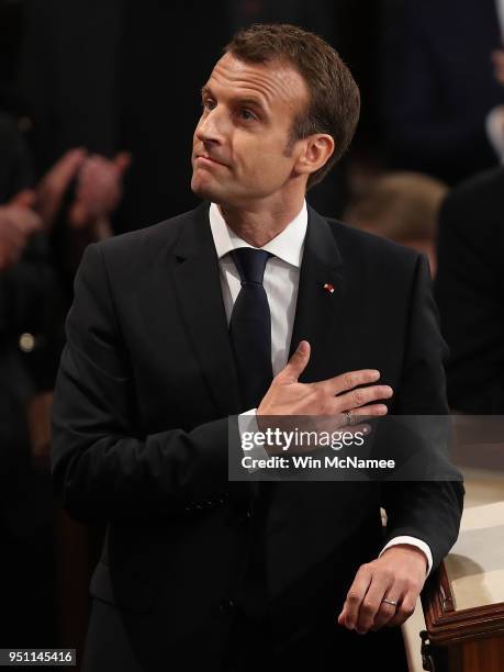 French President Emmanuel Macron reacts to a standing ovation after addressing a joint meeting of the U.S. Congress at the U.S. Capitol April 25,...