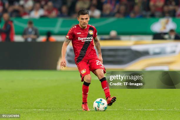 Charles Aranguiz of Leverkusen controls the ball during the DFB Cup semi final match between Bayer 04 Leverkusen and Bayern Munchen at BayArena on...