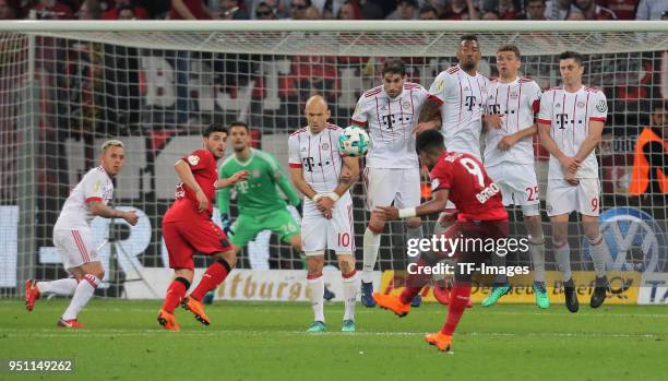 Leon Bailey of Leverkusen shoots a free kick as Rafinha of Muenchen, Kevin Volland of Leverkusen, Arjen Robben, Javier Martinez, Jerome Boateng,...