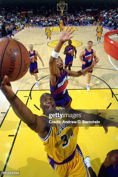 Shaquille O'Neal of the Los Angeles Lakers goes to the basket against the Phoenix Suns on November 1, 1996 at the Great Western Forum in Inglewood,...